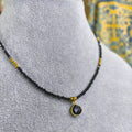 Collar de Espinela negra con dije